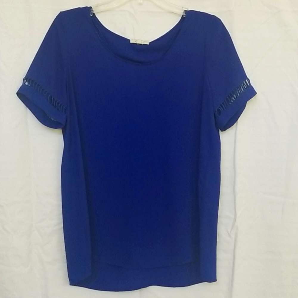 Pleione, royal blue blouse with cutouts